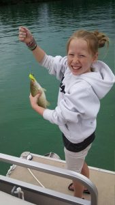 Ally with her first lake fish