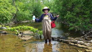Pat Chargot water quality monitoring on a Huron River creek