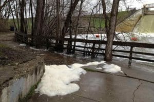 Photo of foam from 2013 that possibly contains PFAS, near Barton Dam, Ann Arbor, by Rebecca Foster.